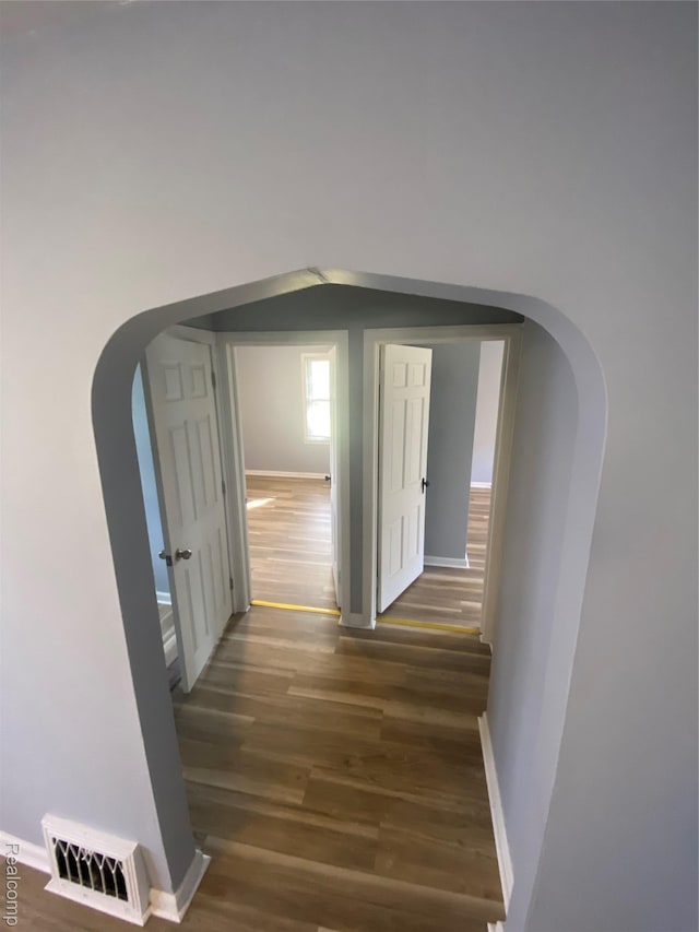 1112 Minnie St, Port Huron, MI 48060 - corridor with arched walkways and wood finished floors