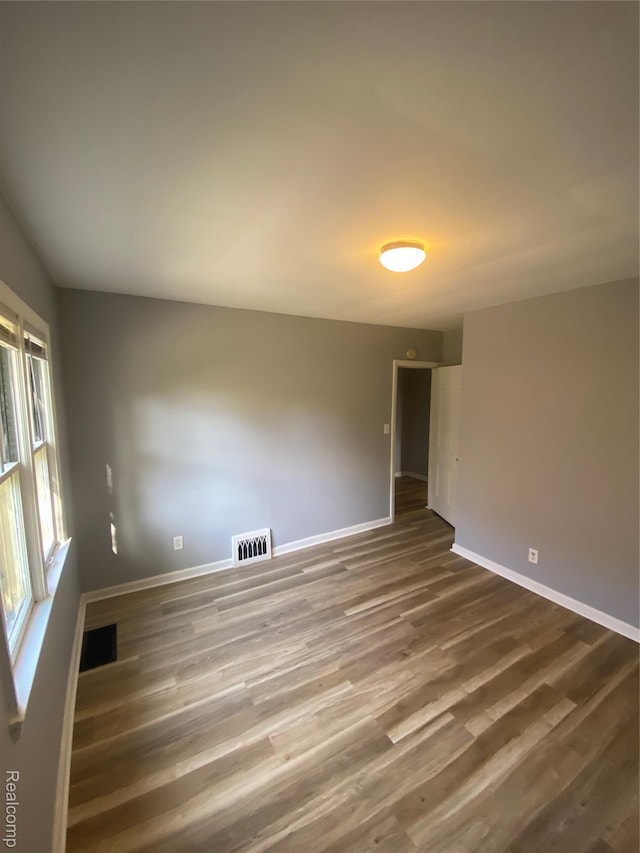 1112 Minnie St, Port Huron, MI 48060 - spare room with baseboards and wood finished floors