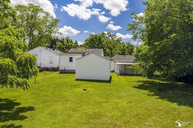 917 E 8th St, Monroe, MI 48161 - rear view of property featuring a shed