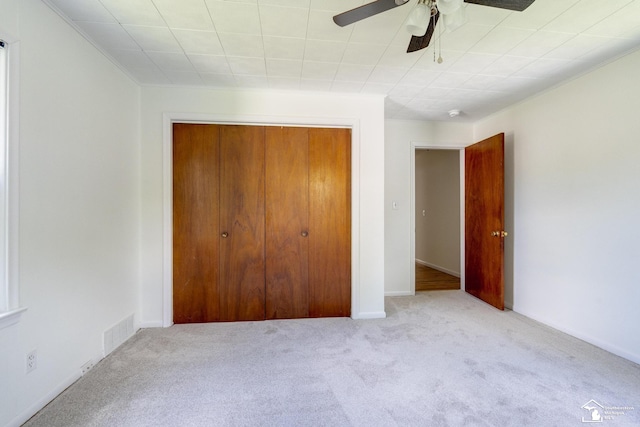 917 E 8th St, Monroe, MI 48161 - unfurnished bedroom featuring carpet flooring, a closet, and ceiling fan