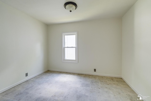 917 E 8th St, Monroe, MI 48161 - spare room with baseboards and light tile patterned flooring