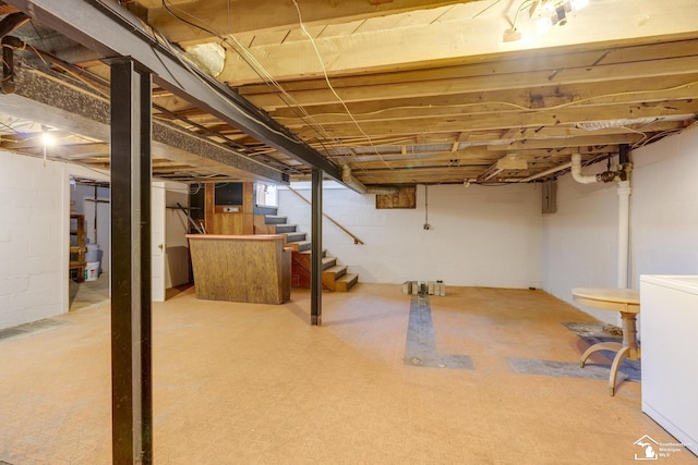 917 E 8th St, Monroe, MI 48161 - below grade area featuring washer / dryer and stairway