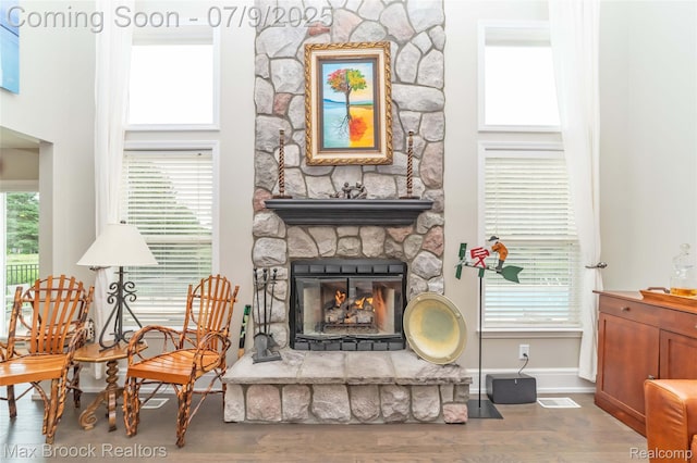 1478 Courtney Ct, Hartland, MI 48353 - living room featuring a stone fireplace and wood finished floors