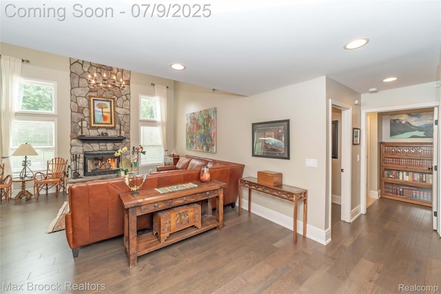 1478 Courtney Ct, Hartland, MI 48353 - living area with dark wood-type flooring, a stone fireplace, and recessed lighting