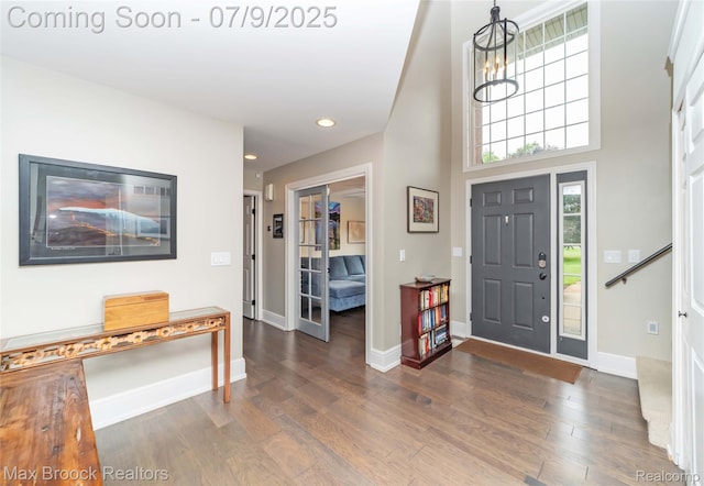 1478 Courtney Ct, Hartland, MI 48353 - entryway with dark wood-type flooring, recessed lighting, a chandelier, and a high ceiling