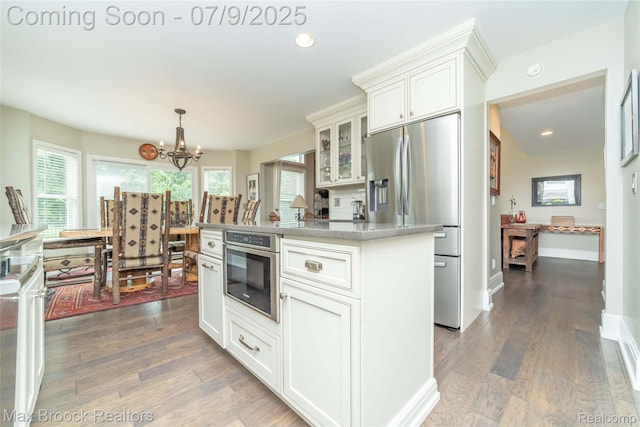 1478 Courtney Ct, Hartland, MI 48353 - kitchen with appliances with stainless steel finishes, glass insert cabinets, healthy amount of natural light, a chandelier, and recessed lighting