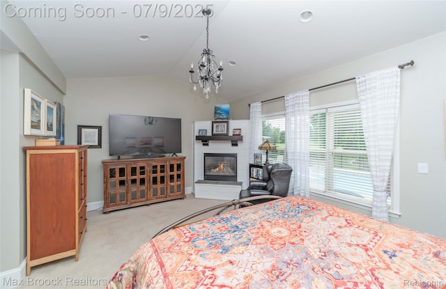 1478 Courtney Ct, Hartland, MI 48353 - bedroom with light colored carpet, a chandelier, lofted ceiling, and a glass covered fireplace