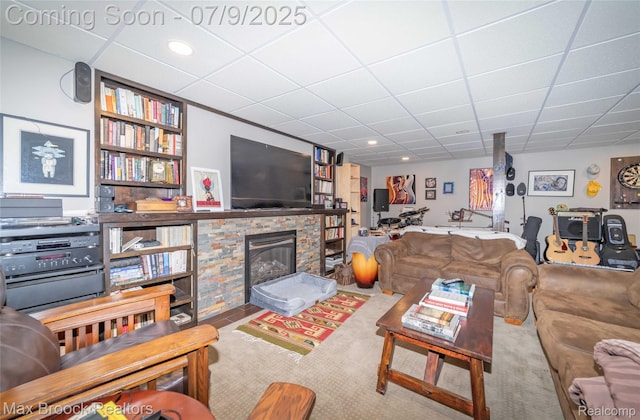 1478 Courtney Ct, Hartland, MI 48353 - living area with a paneled ceiling, a fireplace, carpet floors, and built in shelves