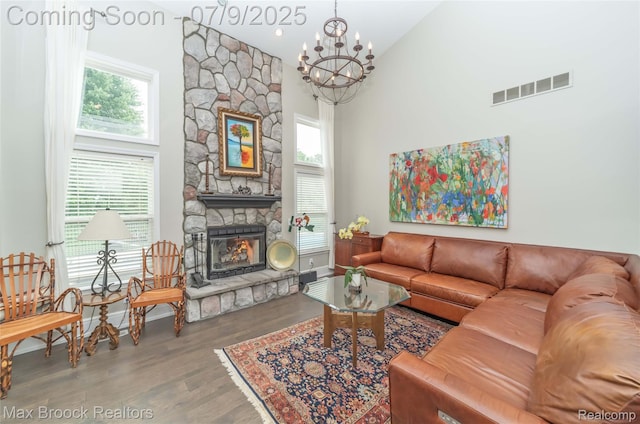 1478 Courtney Ct, Hartland, MI 48353 - living area with a chandelier, a fireplace, wood finished floors, and a high ceiling