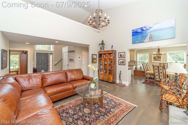 1478 Courtney Ct, Hartland, MI 48353 - living area featuring a chandelier, wood finished floors, plenty of natural light, a high ceiling, and recessed lighting