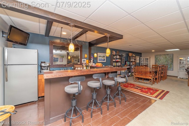 1478 Courtney Ct, Hartland, MI 48353 - indoor dry bar featuring freestanding refrigerator and pendant lighting