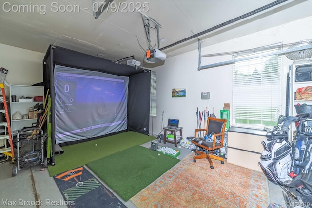1478 Courtney Ct, Hartland, MI 48353 - rec room with golf simulator and concrete flooring
