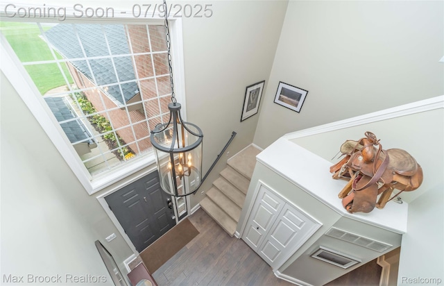 1478 Courtney Ct, Hartland, MI 48353 - entryway featuring dark wood-type flooring, stairway, and a chandelier