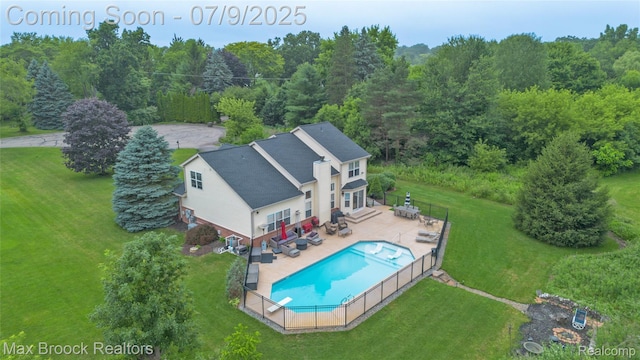 1478 Courtney Ct, Hartland, MI 48353 - view of subject property featuring a pool area and a forest
