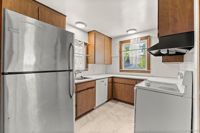 785 Tromley St, Inkster, MI 48141 - kitchen with white appliances, wall chimney range hood, light countertops, and brown cabinets