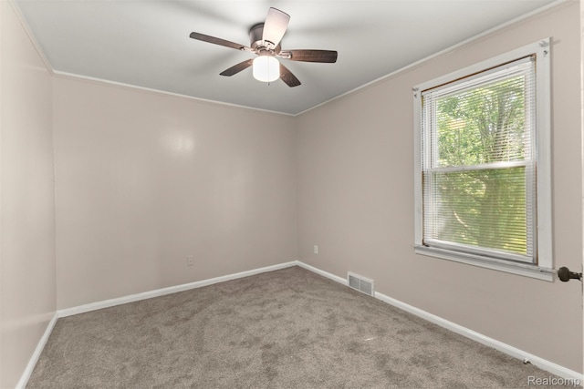 785 Tromley St, Inkster, MI 48141 - spare room featuring crown molding, carpet, and a ceiling fan