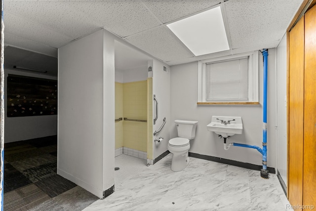 785 Tromley St, Inkster, MI 48141 - bathroom with a shower, a paneled ceiling, and marble finish flooring