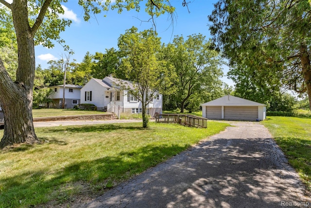 785 Tromley St, Inkster, MI 48141 - view of front of house with a garage, a front lawn, and an outdoor structure