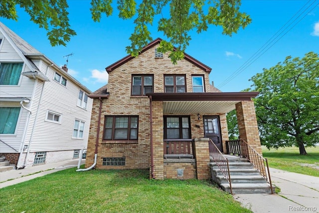 4200 Lois St, Dearborn, MI 48126 - view of front of property with brick siding, covered porch, and a front lawn