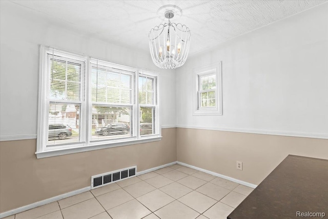 4200 Lois St, Dearborn, MI 48126 - unfurnished dining area with a chandelier and light tile patterned floors