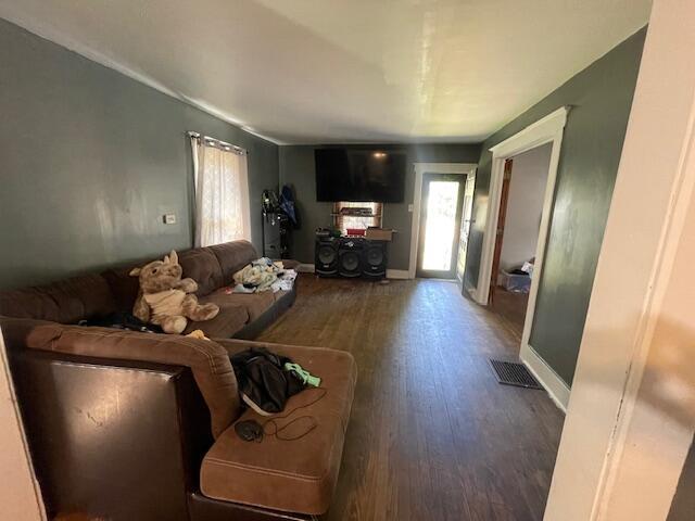 166 N Clay St, Coldwater, MI 49036 - living area featuring wood finished floors and baseboards
