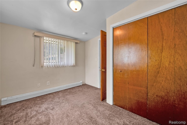 2147 Romeo St, Ferndale, MI 48220 - unfurnished bedroom featuring a baseboard heating unit, carpet, and a closet