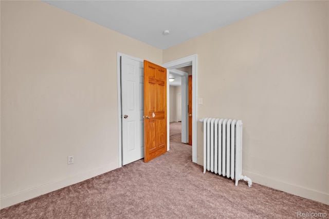 2147 Romeo St, Ferndale, MI 48220 - empty room featuring radiator and light carpet