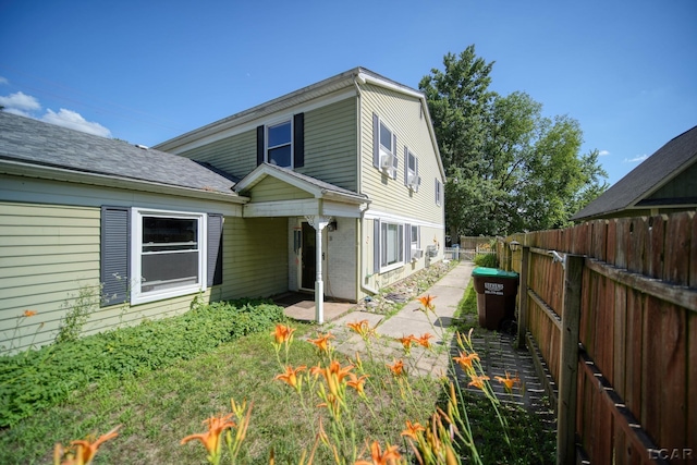 317 Clark St, Clinton, MI 49236 - view of side of property featuring a fenced backyard and brick siding