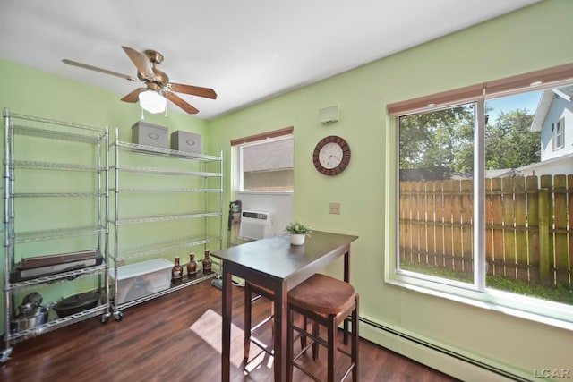 317 Clark St, Clinton, MI 49236 - dining space featuring a baseboard heating unit, ceiling fan, dark wood finished floors, and an AC wall unit