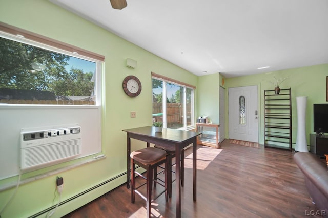 317 Clark St, Clinton, MI 49236 - dining room with a baseboard radiator, wood finished floors, and a wall mounted AC