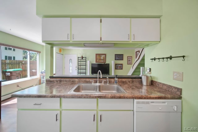 317 Clark St, Clinton, MI 49236 - kitchen featuring white dishwasher, white cabinets, and dark countertops