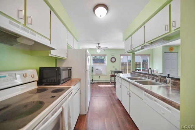 317 Clark St, Clinton, MI 49236 - kitchen with white appliances, under cabinet range hood, white cabinets, and dark wood-type flooring