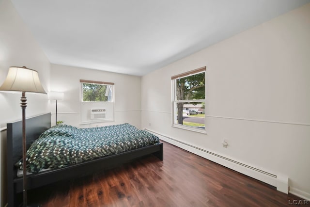 317 Clark St, Clinton, MI 49236 - bedroom with baseboard heating and wood finished floors