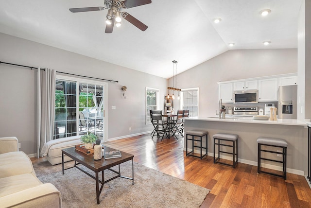 3457 Easy St, Saint Joseph, MI 49085 - living room with a ceiling fan, lofted ceiling, and wood finished floors