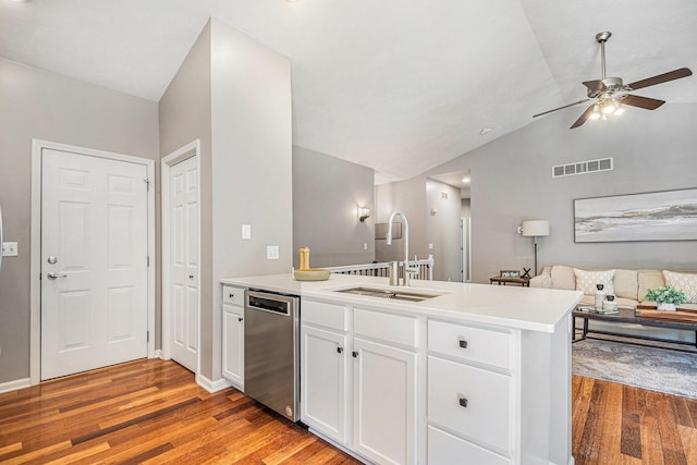 3457 Easy St, Saint Joseph, MI 49085 - kitchen with dishwasher, a peninsula, light wood-style flooring, a ceiling fan, and lofted ceiling
