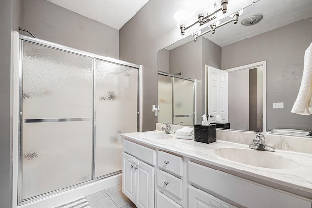 3457 Easy St, Saint Joseph, MI 49085 - full bathroom featuring a stall shower, double vanity, and tile patterned flooring