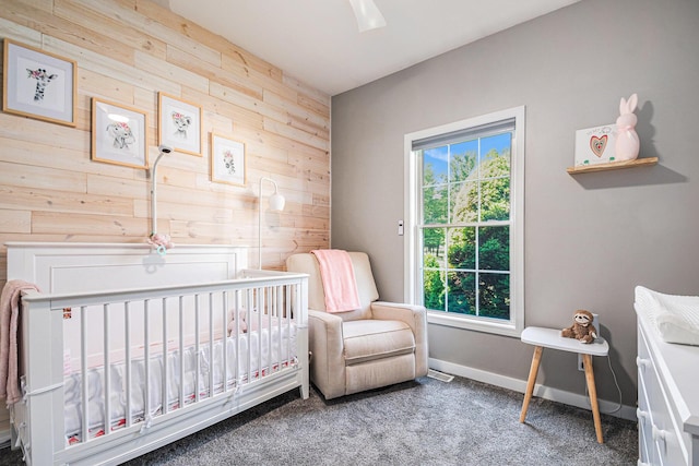 3457 Easy St, Saint Joseph, MI 49085 - carpeted bedroom featuring wooden walls and a crib