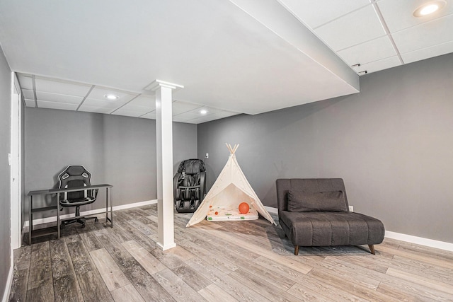 3457 Easy St, Saint Joseph, MI 49085 - living area with a drop ceiling, wood finished floors, ornate columns, and recessed lighting