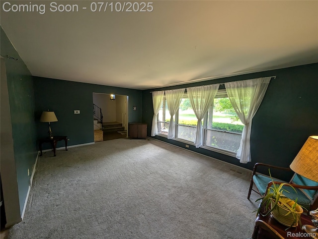 1391 Dye Krest Cir, Flint, MI 48532 - unfurnished living room featuring stairs and carpet floors