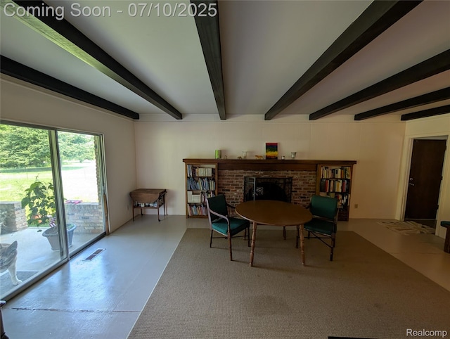 1391 Dye Krest Cir, Flint, MI 48532 - living area featuring beam ceiling, a brick fireplace, and finished concrete flooring