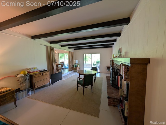 1391 Dye Krest Cir, Flint, MI 48532 - dining space featuring beamed ceiling and a brick fireplace