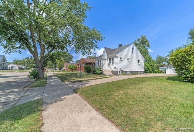 20892 Dean St, Warren, MI 48091 - view of side of property with a chimney and a lawn