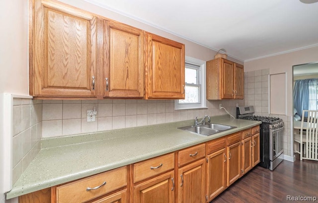 20892 Dean St, Warren, MI 48091 - kitchen featuring stainless steel range with gas stovetop, plenty of natural light, light countertops, dark wood finished floors, and ornamental molding