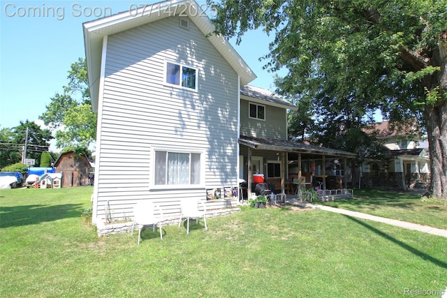 116 N Shiawassee St, Bancroft, MI 48414 - rear view of property featuring a yard