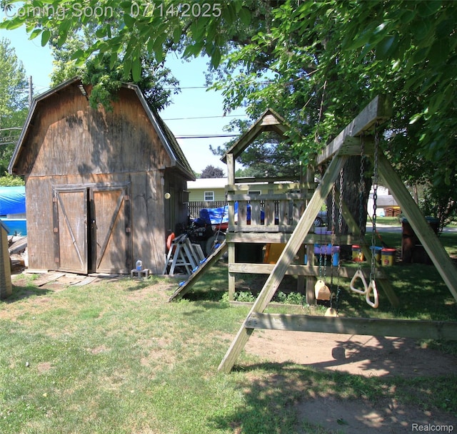 116 N Shiawassee St, Bancroft, MI 48414 - view of green lawn featuring an outdoor structure, a wooden deck, and a barn