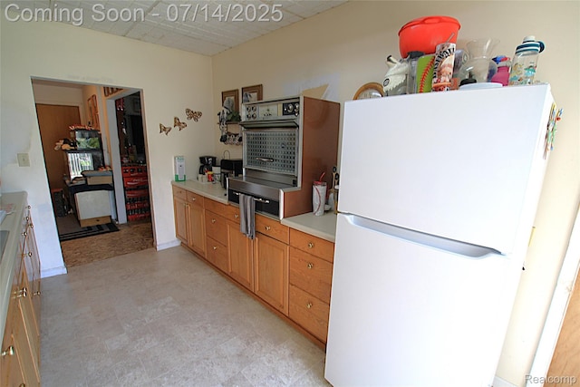 116 N Shiawassee St, Bancroft, MI 48414 - kitchen featuring freestanding refrigerator, light countertops, and light floors