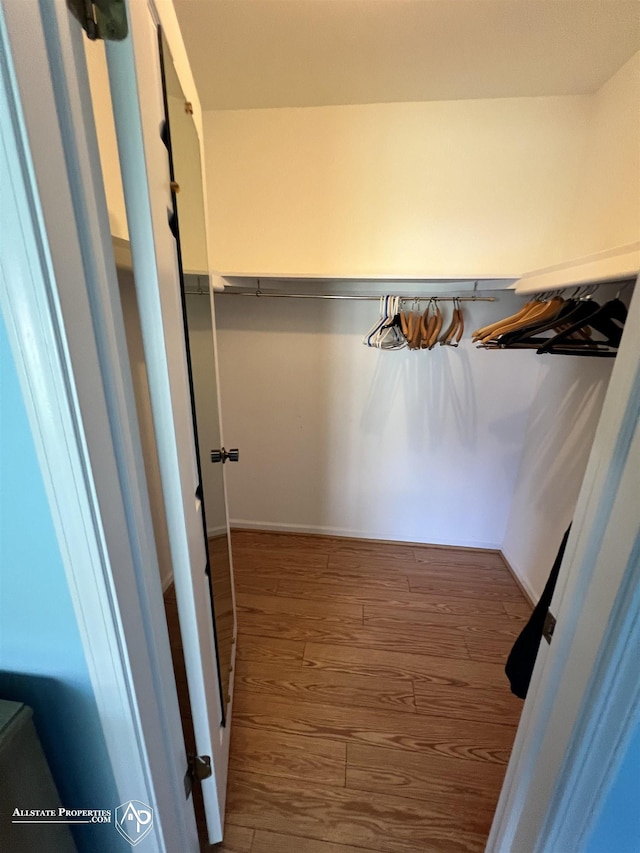 13939 Harrington Dr, Warren, MI 48088 - spacious closet featuring wood finished floors