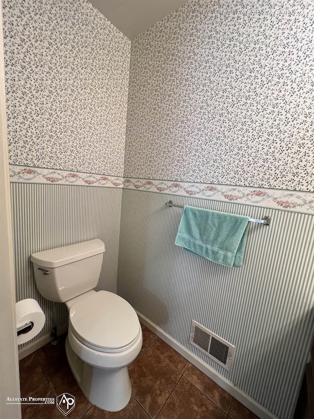13939 Harrington Dr, Warren, MI 48088 - bathroom with wallpapered walls, a wainscoted wall, and tile patterned flooring