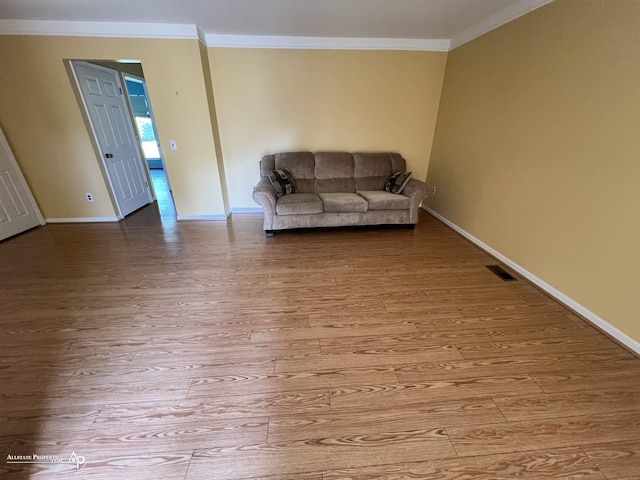 13939 Harrington Dr, Warren, MI 48088 - living area featuring crown molding and light wood finished floors