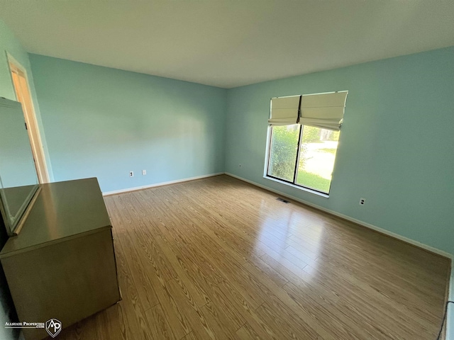 13939 Harrington Dr, Warren, MI 48088 - empty room featuring wood finished floors and baseboards